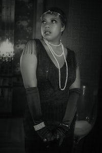 black and white photo of a woman in a flapper dress